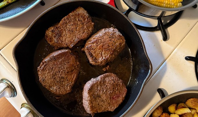best steak delivery service: snake river farms steaks, cooking in a skillet