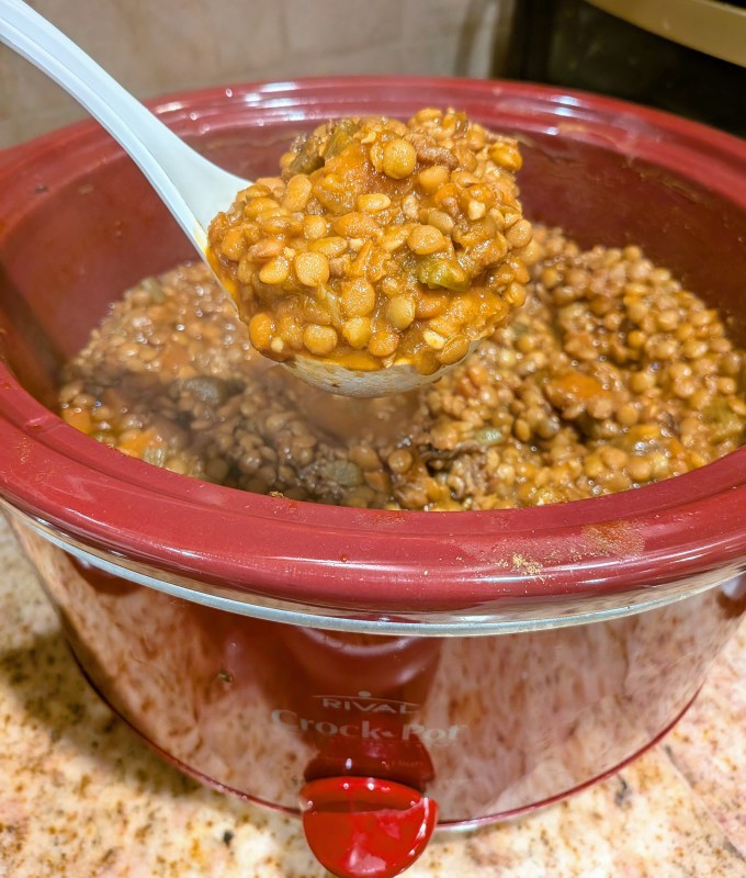 reese witherspoon's slow cooker lentil soup ladled from crockpot